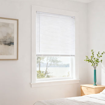 White PVC window blind with horizontal slats, installed on a window