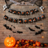 Halloween double pennant garland spelling HAPPY and HALLOWEEN on black triangles