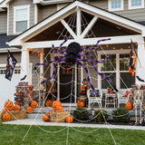 Giant Halloween spider decoration with black body and purple-striped legs with white web net