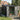 Metal tool shed with open double doors, dark exterior and light interior panels