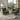 Green chenille single sofa armchair with wooden tapered legs and wide arms