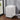 White rolling file cabinet with 3 drawers, caster wheels, front view