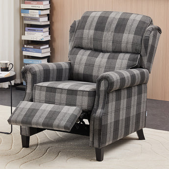 Grey plaid recliner chair with extended footrest and thick cushioned seat.
