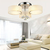 Chrome and crystal flush mount ceiling light with three frosted acrylic arms