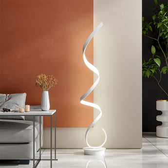 LED spiral floor lamp with glowing white wavy tube and round white base.
