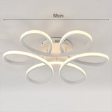 LED semi-ceiling luminaire, 58 cm wide, with five white petal rings and central mount