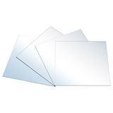 Four acrylic mirror tile sheets laid flat, glossy reflective surfaces