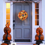 Halloween wreath with orange floral foliage and small pumpkin and owl ornaments