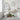 White tall bathroom storage cabinet with open shelves and a central top door