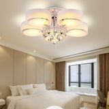 Multi-arm flush ceiling light with frosted acrylic shades and dangling crystal ornaments