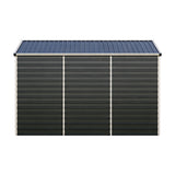 Metal shed exterior wall with dark gray ribbed panels and blue roof