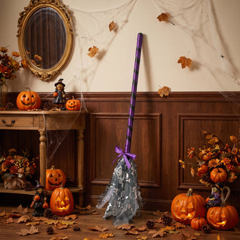 Halloween wand decoration featuring purple-striped pole and silver skull-pattern tulle