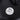 Close-up thermometer gauge on black charcoal grill smoker lid, 150–350°F range