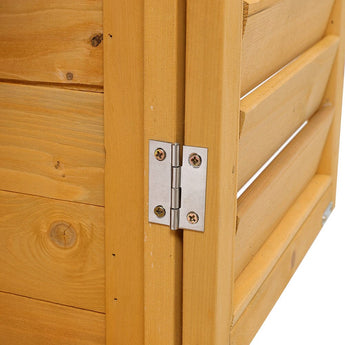 Wood storage shed door hinge with silver metal hardware on light wooden frame