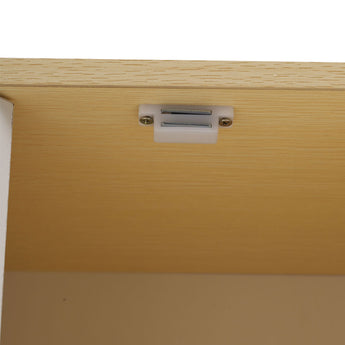 Top hinge hardware on the wooden cabinet door
