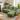 Green L-shaped corner sofa with chaise section and three seat cushions, side angle view.