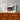 White electric fireplace with flame view and remote temperature control icons