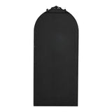 Back view of black arched freestanding mirror with decorative top