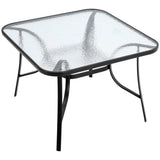Square glass-top outdoor table with black rim and speckled clear finish