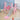 Kids swing and slide set with basketball hoop, pink frame and light gray slide