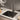 Black single-bowl stainless sink with undermount-style rim and integrated strainer