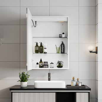 Open white LED mirror cabinet with shelves holding bottles and toiletries