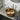 Round bronze ceramic vessel sink basin with central drain opening