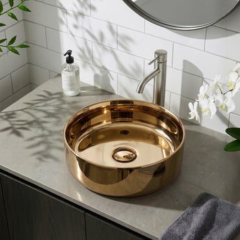 Round bronze ceramic vessel sink basin with central drain opening