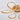 Golden acrylic LED semi-flush mount ceiling light close-up with white and gold ring loops