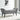 Grey velvet ottoman footstool with raised arms, cushioned seat and dark legs
