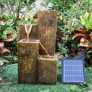 Solar powered garden water fountain with stacked wood-style tiers, water flowing