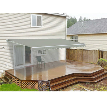 Grey manual retractable patio awning over patio seating on an outdoor deck