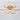 Gold acrylic LED semi-flush mount ceiling light with five oval white rings and gold canopy