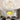 White flower-shaped LED ceiling light, glowing multi-petal rings