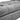 Grey velvet ottoman footstool, close-up of stitched seat cushions and plush padding