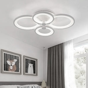 White circular LED semi-flush mount ceiling light with four glowing ring sections