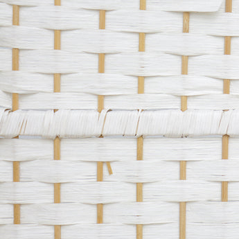 Close-up of white woven rattan panel with grid weave and light wood accents