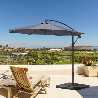 Dark grey cantilever outdoor parasol umbrella open on terrace with curved arm