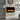 Wall-mounted electric fireplace with glowing flame and built-in control panel