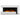 Close-up of freestanding electric fireplace insert with white trim, orange flame and logs.