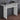 White makeup table with open lower shelf and tabletop for decor and accessories.