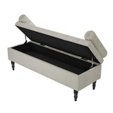 Beige linen upholstered storage bench with hinged lid open to show interior storage