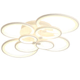 Circular LED ceiling light with multiple ring-shaped light panels, white housing