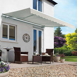 Grey manual retractable patio awning extended above outdoor seating area