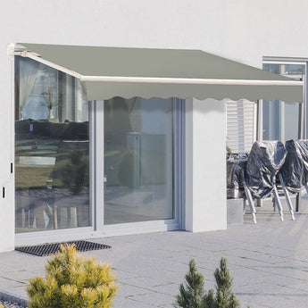 Grey manual retractable patio awning extended above sliding glass doors